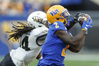 Central Florida defensive back Nevelle Clarke (14) breaks ups a pass tp Pittsburgh wide receiver Maurice Ffrench (2) during the second half of an NCAA college football game, Saturday, Sept. 21, 2019, in Pittsburgh. (AP Photo/Keith Srakocic)