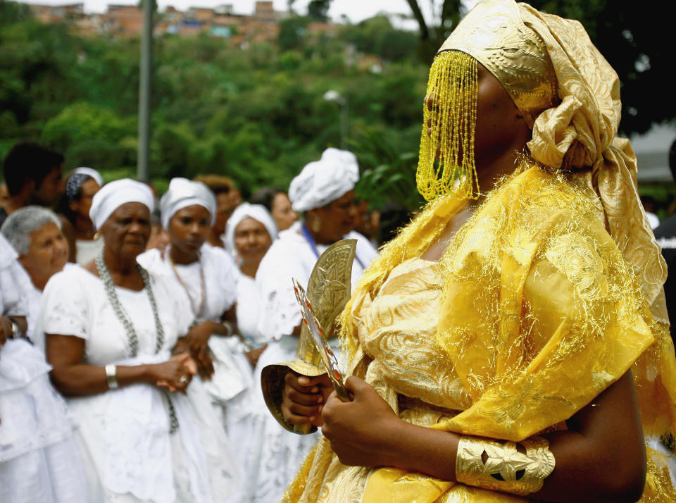 As a child, I was told that Vodou was scary and sinful. It wasn't until much later that I learned of its true beauty. The worshipper pictured here is dressed as Oshun, the river deity. (Joa Souza / Shutterstock)