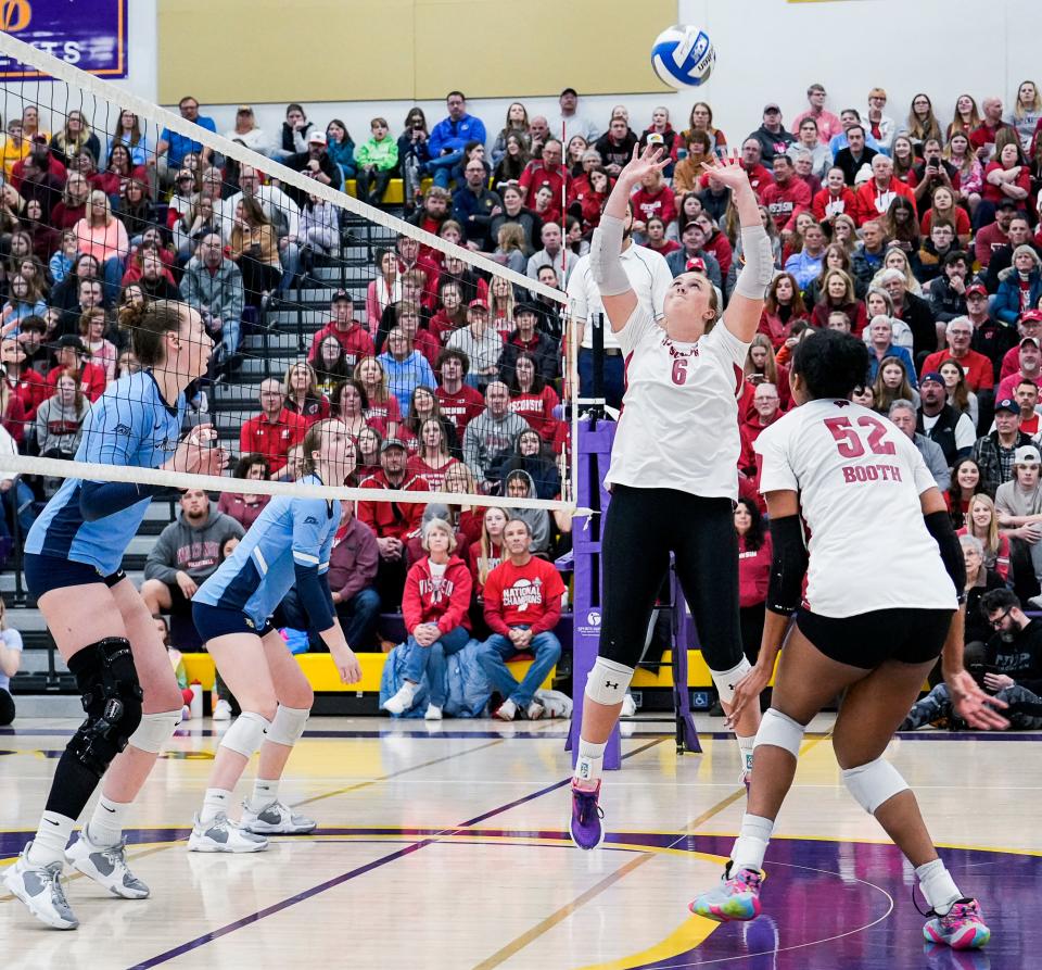 Wisconsin setter MJ Hammill (6) sets the ball for middle blocker Carter Booth during a scrimmage against Marquette on March 31, 2023, at Oconomowoc High School.