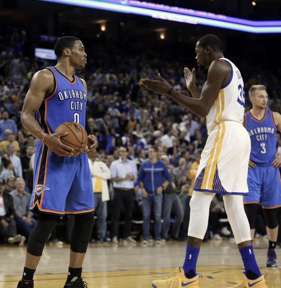 Russell Westbrook (left) scored 20 points while missing 11 of 15 shots against the Warriors. (AP)