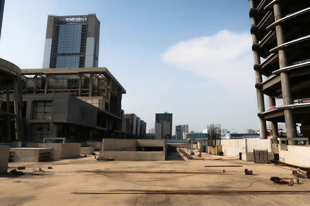 The construction site surrounding the Goldin Finance 117 skyscraper lies dormant in Tianjin's high-tech zone, China, May 25, 2018. REUTERS/Yawen Chen