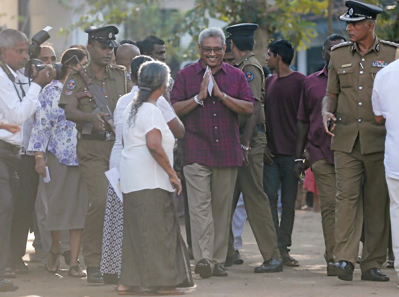 Sri Lanka People's Front party presidential election candidate and former wartime defence chief Rajapaksa leaves after casting his vote during the presidential election in Colombo