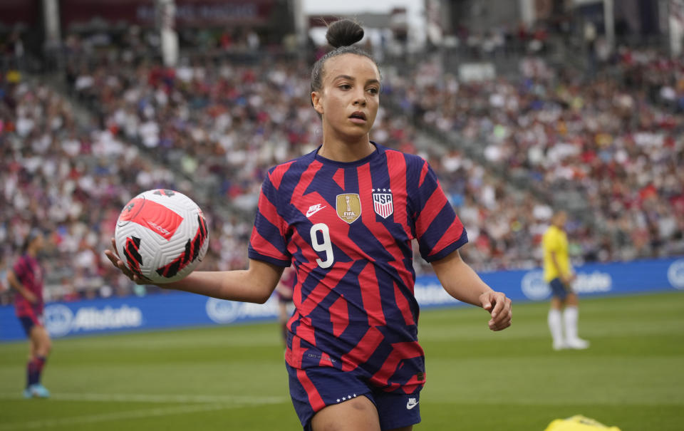 U.S. forward Mallory Pugh looks to put the ball back into play during the first half of the team's international friendly soccer match against Colombia on Saturday, June 25, 2022, in Commerce City, Colo. (AP Photo/David Zalubowski)