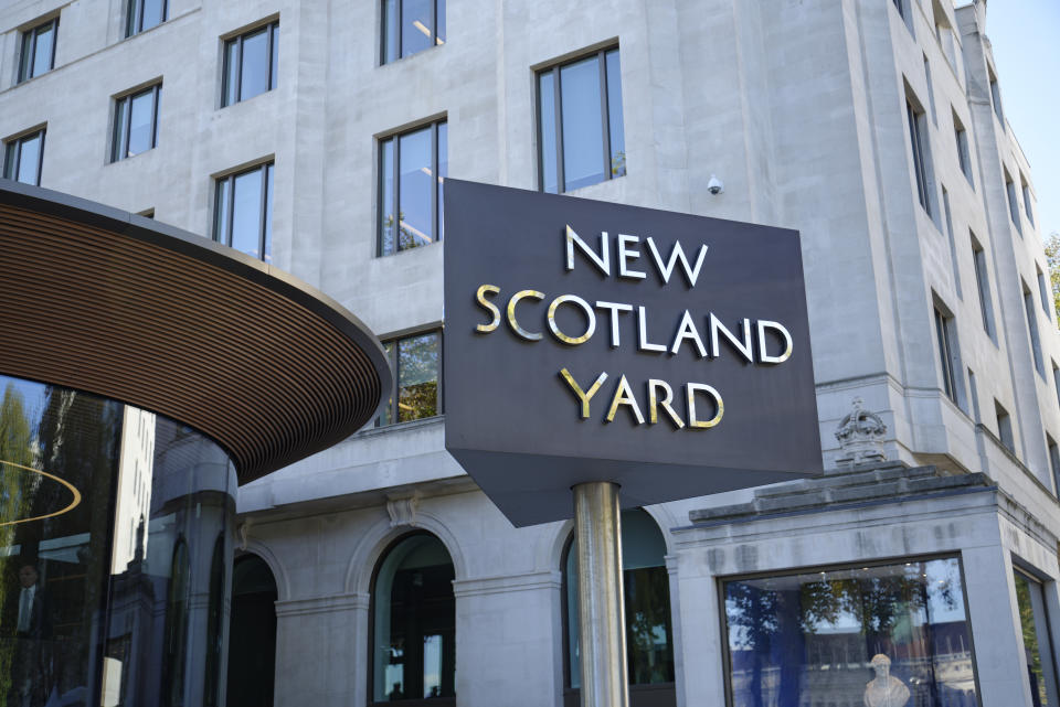 Turning sign outside of New Scotland Yard. The Metropolitan Police headquarters in London, UK.