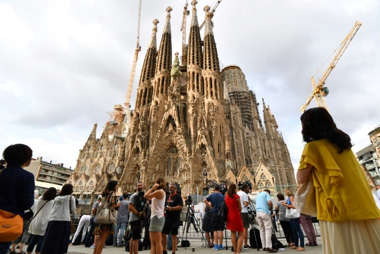 A grief-stricken Barcelona commemorates victims of two devastating terror attacks with a mass in the city's stunning Sagrada Familia church