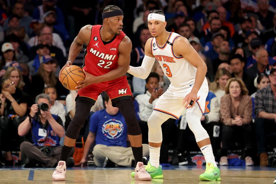 Heat forward Jimmy Butler controls the ball against Knicks guard Josh Hart in Game 7.