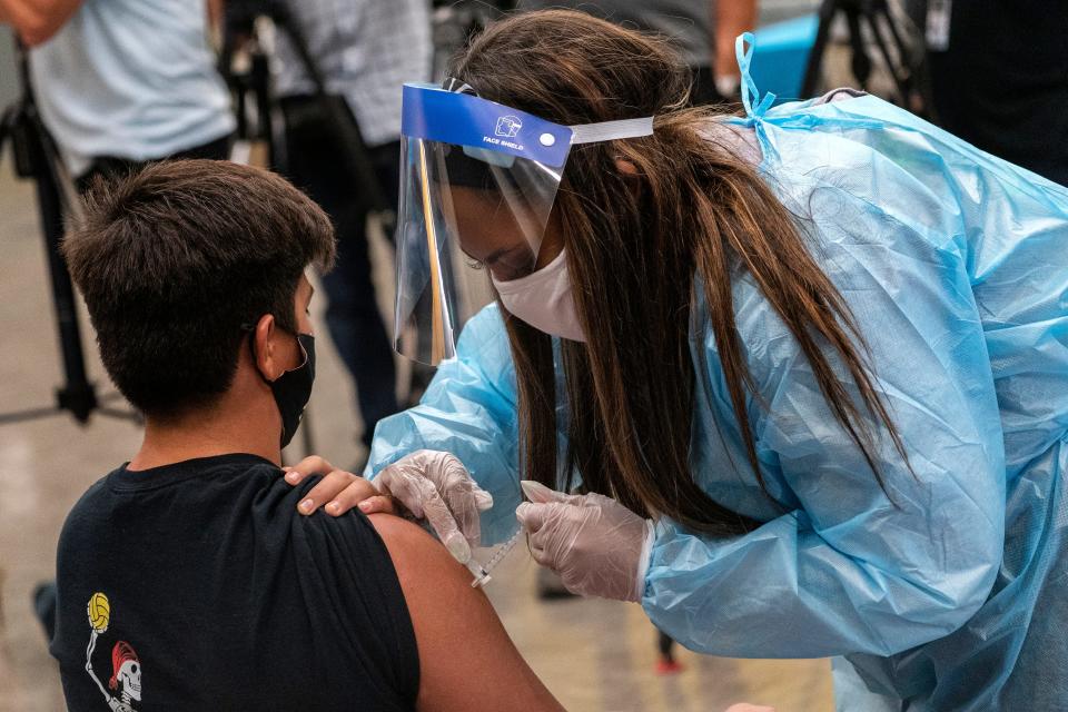 Marc Bugarin, 15, at a school-based COVID-19 vaccination clinic for students 12 and older in San Pedro, Calif., May 24, 2021.