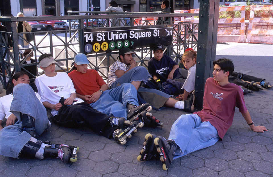 Early '90s teens in NYC hanging out on the sidewalk wearing Roller Blades