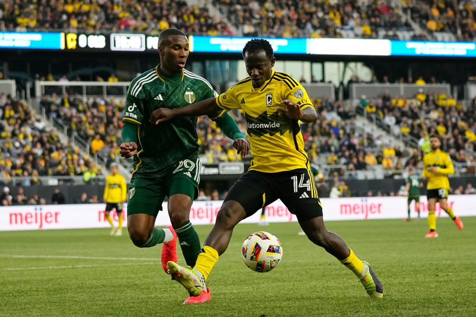 Crew midfielder Yaw Yeboah dribbles around Portland Timbers defender Juan Mosquera during a 2-2 draw at Lower.com Field.
