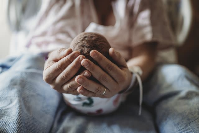 <p><br/></p><p>Cavan Images</p> Stock image of mom holding newborn baby