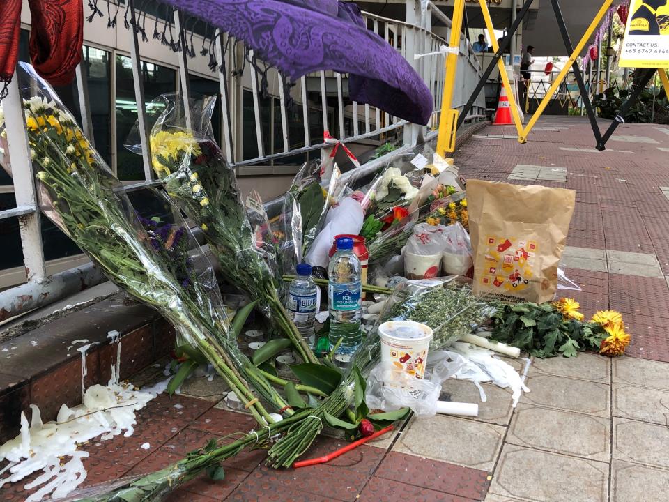 Tributes left to the victims at the accident site along Nutmeg Road, outside Lucky Plaza on Tuesday, 31 December 2019. PHOTO: Nicholas Yong/Yahoo News Singapore 