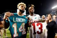 Dec 14, 2015; Miami Gardens, FL, USA; Miami Dolphins wide receiver Jarvis Landry (14) and New York Giants wide receiver Odell Beckham Jr. (13) both display their signed jersey's after their game at Sun Life Stadium. Steve Mitchell-USA TODAY Sports