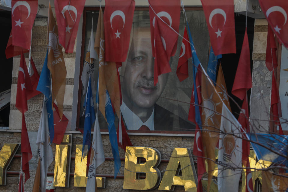 Turkish President Recep Tayyip Erdogan’s portrait in front of damaged building in Hatay, Turkey, on Feb. 13, 2023.<span class="copyright">Aziz Karimov—Getty Images</span>