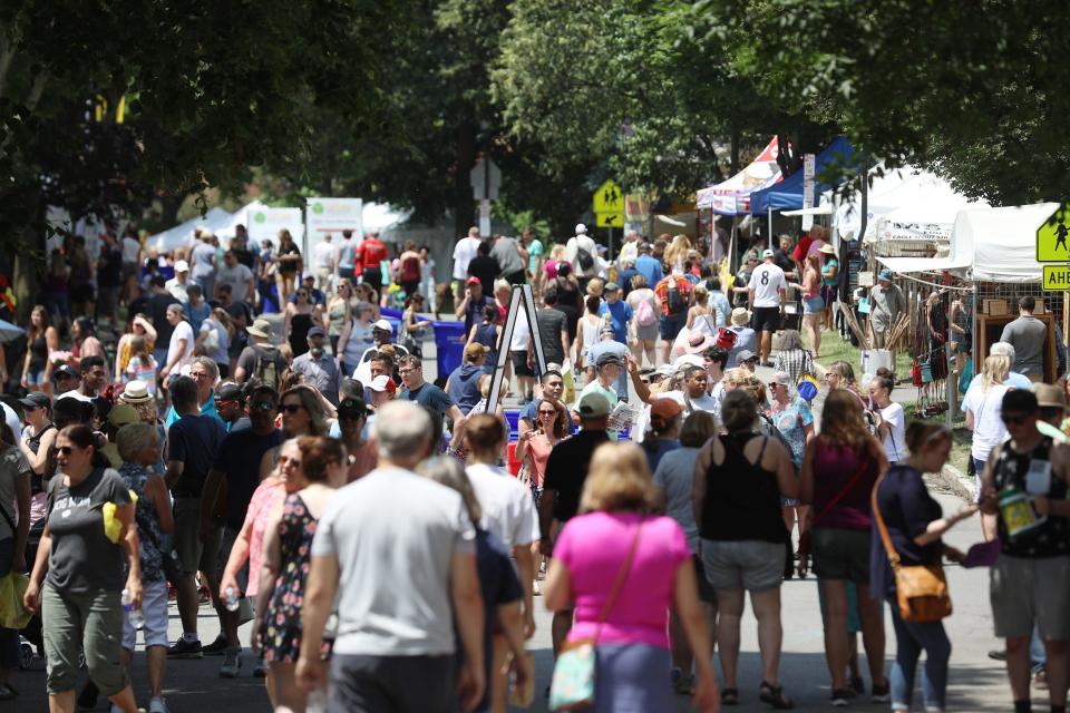 File Photo: A steady flow of people perused the various booths at the 51st Annual Corn Hill Festival.