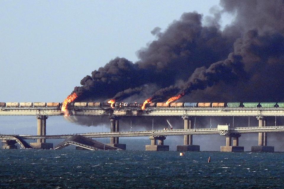 Black smoke billows from a fire on the bridge that links Crimea to Russia after a truck exploded near Kerch, igniting a massive fire and damaging the bridge – built as Russia's sole land link with annexed Crimea – and vowed to find the perpetrators without immediately blaming Ukraine.