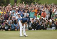 Jordan Spieth of the U.S. reacts as his putt sinks to win the Masters golf tournament at the Augusta National Golf Course in Augusta, Georgia April 12, 2015. REUTERS/Mark Blinch