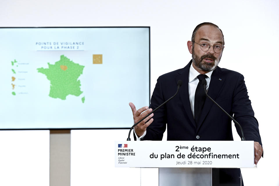 French Prime Minister Edouard Philippe speaks during a televised address in Paris Thursday, May 28, 2020. France is reopening its restaurants, bars and cafes starting next week as the country eases most restrictions amid the coronavirus crisis. Edouard Philippe defended the gradual lifting of lockdown up to now, saying the strategy was meant to avoid provoking a second wave. (Philippe Lopez, Pool via AP)