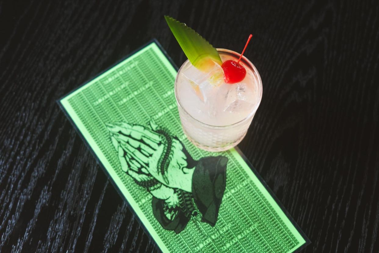 Nightcrawler's Hex on the Beach is a coconut milk punch Piña Colada made with a dark and light rum blend, velvet falernum, tiki bitters, fresh pineapple and lime, Demerara and pineapple coconut water. It's clarified with coconut milk & cream.