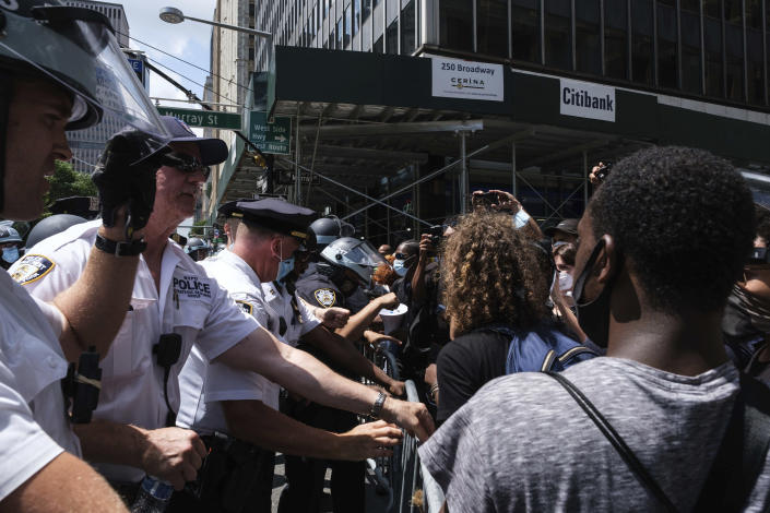 Black Lives Matter protesters and NYPD officers have confrontation near City Hall Park, Wednesday, July 15, 2020, in New York. (AP Photo/Yuki Iwamura)