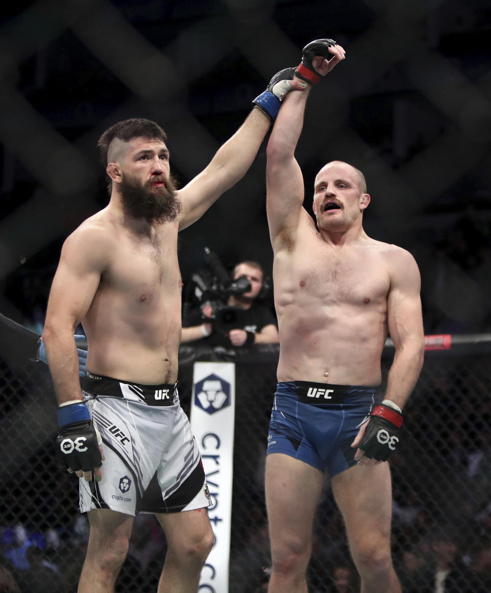 Bryan Barberena, left, congratulates Gunnar Nelson on his win after their welterweight bout during the UFC 286 mixed martial arts event at O2 Arena, in London, Saturday, March 18, 2023. (Kieran Cleeves/PA via AP)