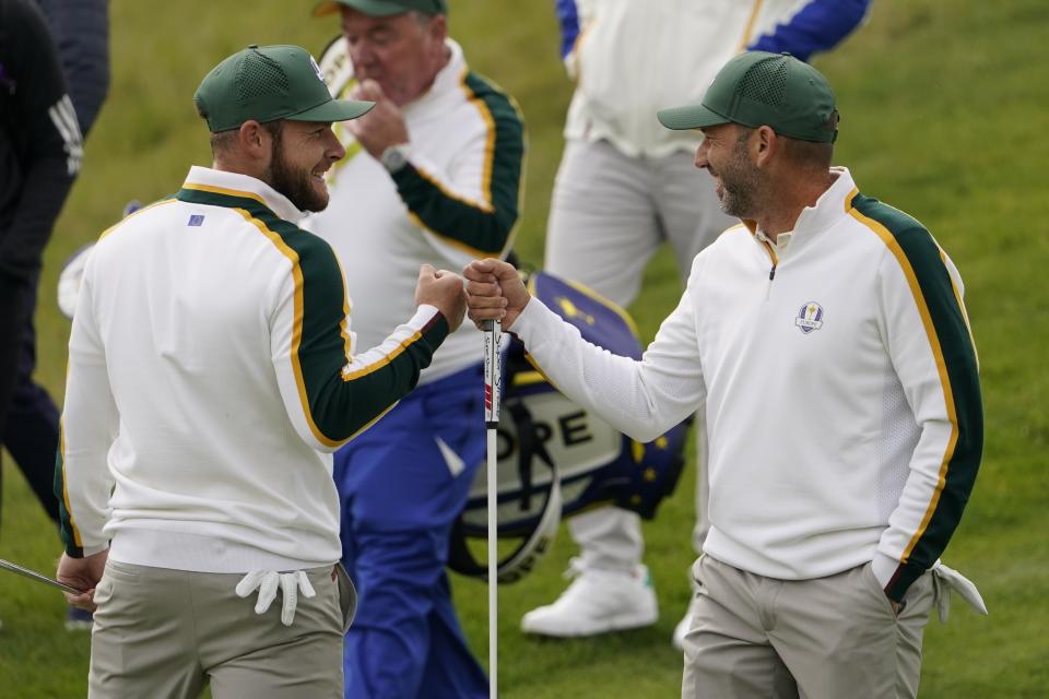 Team Europe's Sergio Garcia and Team Europe's Tyrrell Hatton fist pump on the sixth hole during a practice day at the Ryder Cup at the Whistling Straits Golf Course Wednesday, Sept. 22, 2021, in Sheboygan, Wis. (AP Photo/Jeff Roberson)