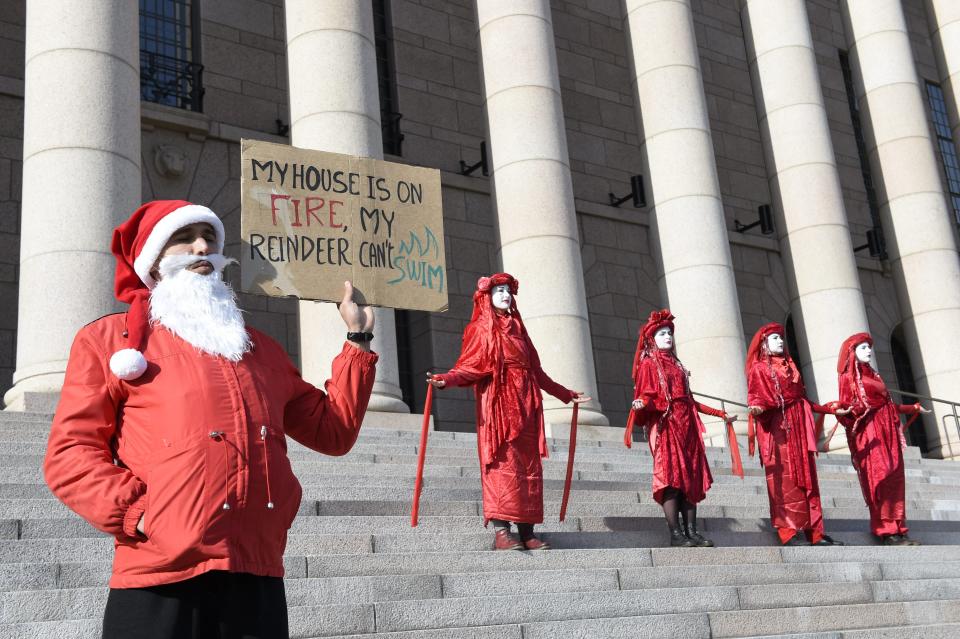 Climate protesters demonstrate outside the parliament house in Helsinki, Finland, Friday, Sept. 20, 2019.  (Photos: Emmi Korhonen/Lehtikuva via AP)