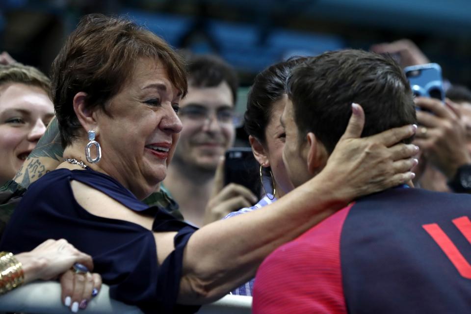 <p>Gold medalist Michael Phelps of the United States celebrates with his mother Deborah Phelps, fiancee Nicole Johnson and son Boomer during the medal ceremony for the Men’s 200m Butterfly Final on Day 4 of the Rio 2016 Olympic Games at the Olympic Aquatics Stadium on August 9, 2016 in Rio de Janeiro, Brazil. (Photo by Al Bello/Getty Images) </p>