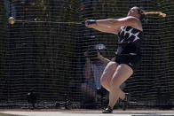 DeAnna Price reacts after sets a new American record during the finals of the women's hammer throw at the U.S. Olympic Track and Field Trials Saturday, June 26, 2021, in Eugene, Ore.(AP Photo/Ashley Landis)