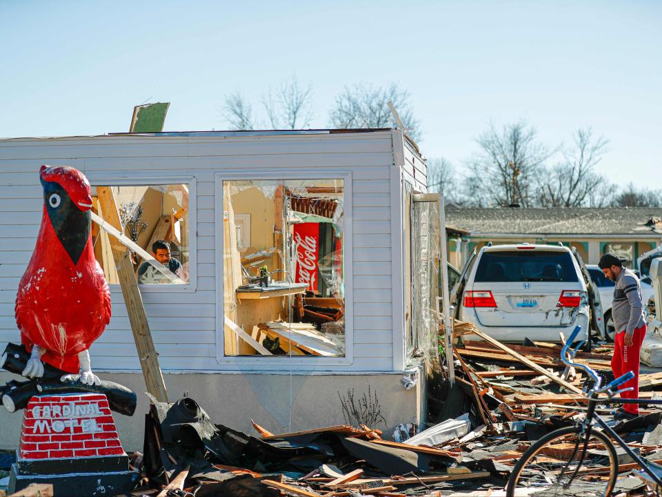 Pete Desai, owner of the Cardinal Motel in Bowling Green, Kentucky surveys tornado damage on December 12, 2021 (AFP via Getty Images)