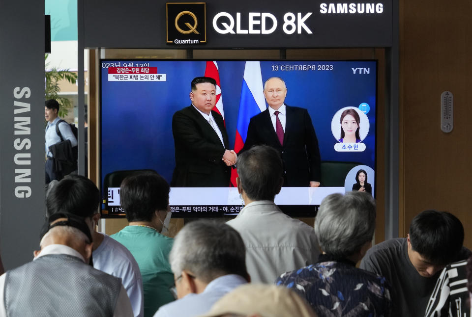 A TV screen shows an image of a meeting between Russian President Vladimir Putin, right, and North Korea's leader Kim Jong Un during a news program at the Seoul Railway Station in Seoul, South Korea, Thursday, Sept. 14, 2023. Kim vowed "full and unconditional support" for Putin on Wednesday as the two leaders isolated by the West held a summit that the U.S. warned could lead to a deal to supply ammunition for Moscow's war in Ukraine. (AP Photo/Ahn Young-joon)