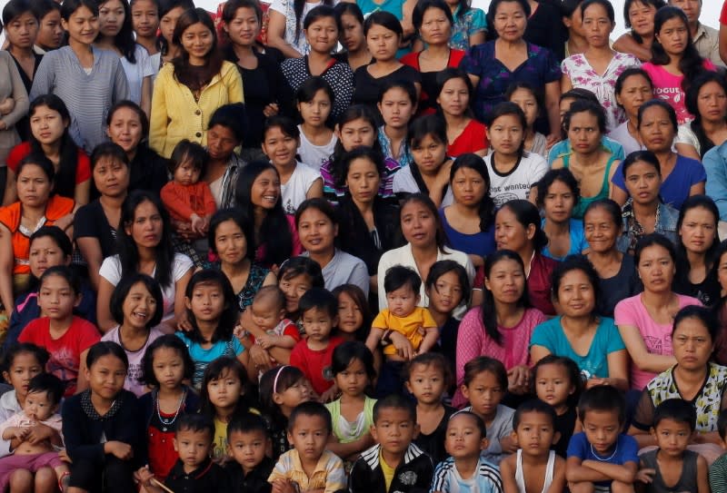 FILE PHOTO: Family members of Ziona poses for group photograph outside their residence in Baktawng