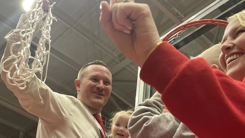 Manti coach Devin Shakespear holds the net up after the Templars’ state championship win.