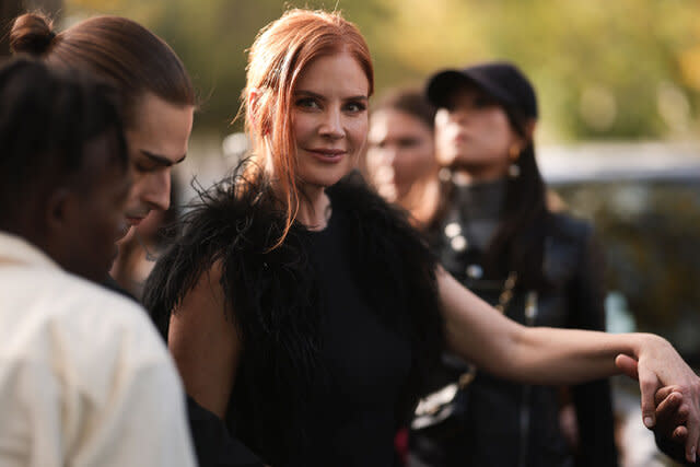 Sarah Rafferty photographed wearing a black dress