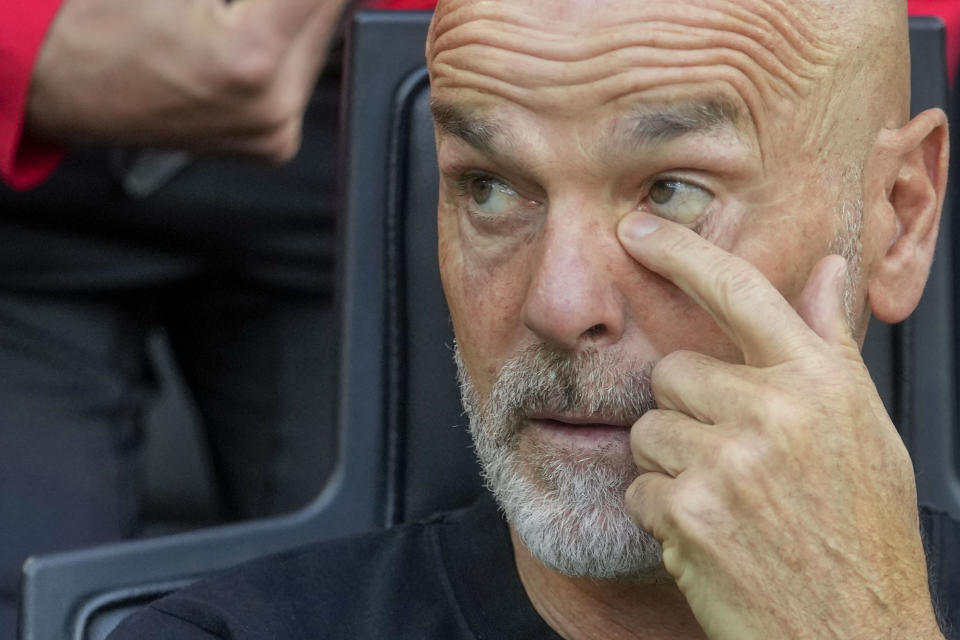 AC Milan's manager Stefano Pioli looks out from the bench prior a Serie A soccer match between AC Milan and Genoa, at the San Siro stadium in Milan, Italy, Sunday, May 5, 2024. (AP Photo/Luca Bruno)