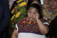 Guatemalan migrant Juana Alonso Santizo clears her eyes after arriving at La Aurora international airport in Guatemala City, Sunday, May 22, 2022. Alonso Santizo who was imprisoned in northeastern Mexico for seven years while trying to migrate to the United States and who was arrested on kidnapping charges was released on Saturday, May 21, after numerous organizations and even Mexican President Andres Manuel Lopez Obrador interceded on her behalf. (AP Photo/Moises Castillo)