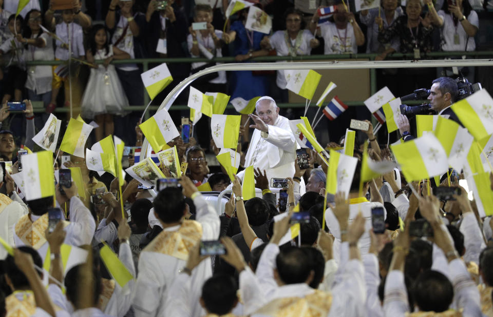 Pope Francis waves the as he arrives to celebrate a Mass at the National Stadium, Thursday, Nov. 21, 2019, in Bangkok, Thailand. (AP Photo/Gregorio Borgia)