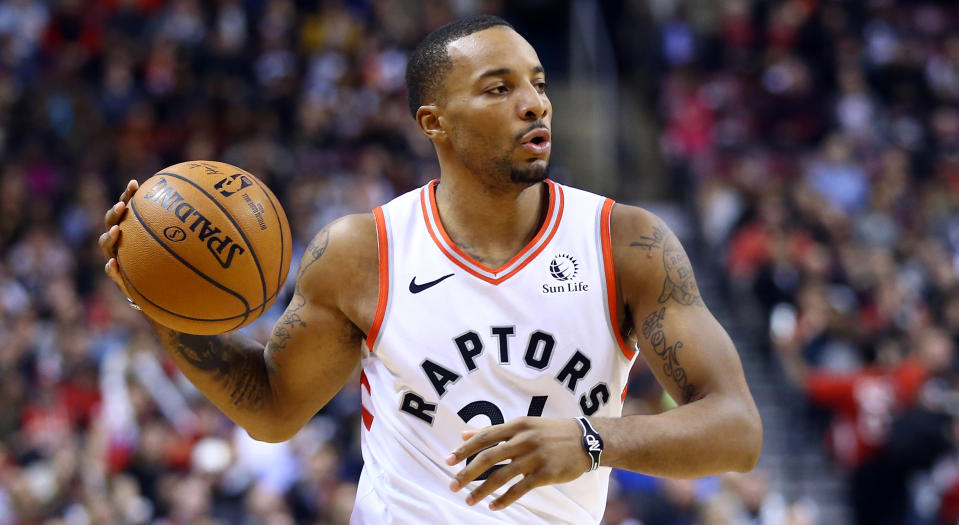 Norman Powell of the Toronto Raptors exited Wednesday night's contest in Detroit late in the fourth quarter after being crushed by a defender. (Photo by Vaughn Ridley/Getty Images)