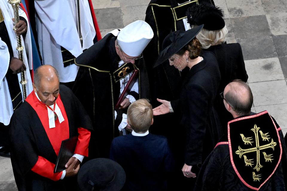 Catherine, Princess of Wales arrives with Prince George of Wales at Westminster Abbey.