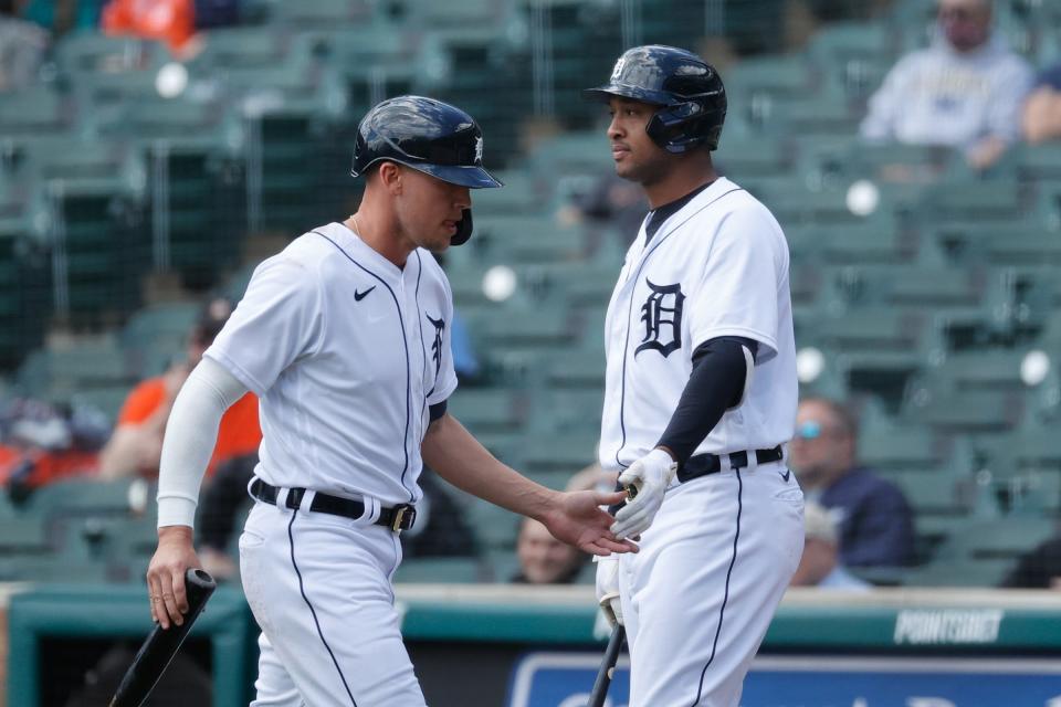 Detroit Tigers left fielder JaCoby Jones (21) receives congratulations from second baseman Jonathan Schoop (7) after scoring in the second inning against the Kansas City Royals at Comerica Park.