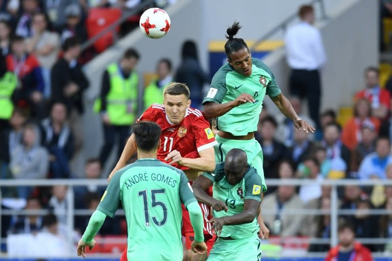 Russia's forward Alexander Bukharov (C) vies with Portugal's defender Bruno Alves (up R) and Portugal's midfielder Danilo (bottom R) during the 2017 Confederations Cup group A football match June 21, 2017