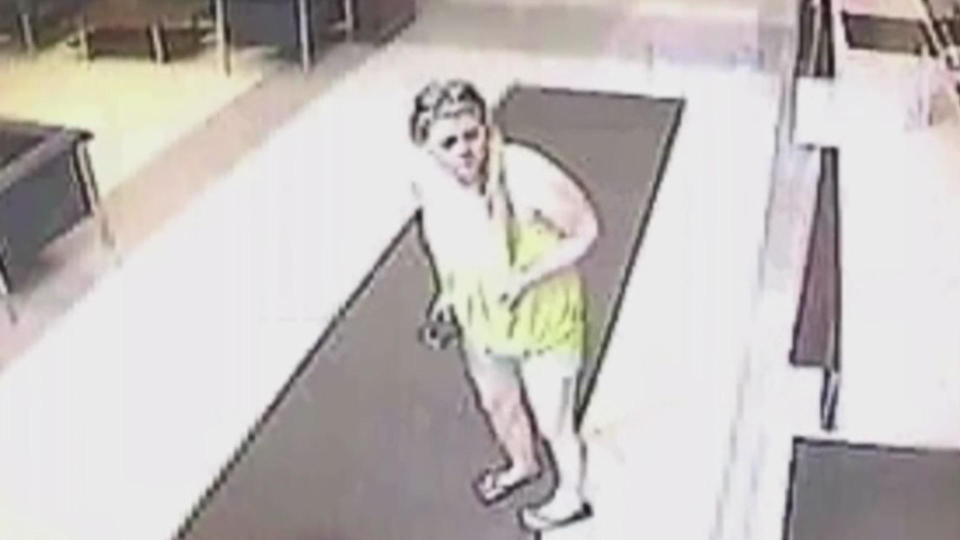 Suffolk County Police Commissioner Rodney Harrison released video never seen by the public of a lobby of the Holiday Inn Express in Hauppauge on June 4 and 6 in 2010. Seen in a yellow top is Megan Waterman in her final hours. / Credit: Suffolk County Police