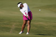 Lilia Vu hits an approach shot on the 13th hole during the LPGA The Ascendant golf tournament in The Colony, Texas, Thursday, Sept. 29, 2022. (AP Photo/LM Otero)