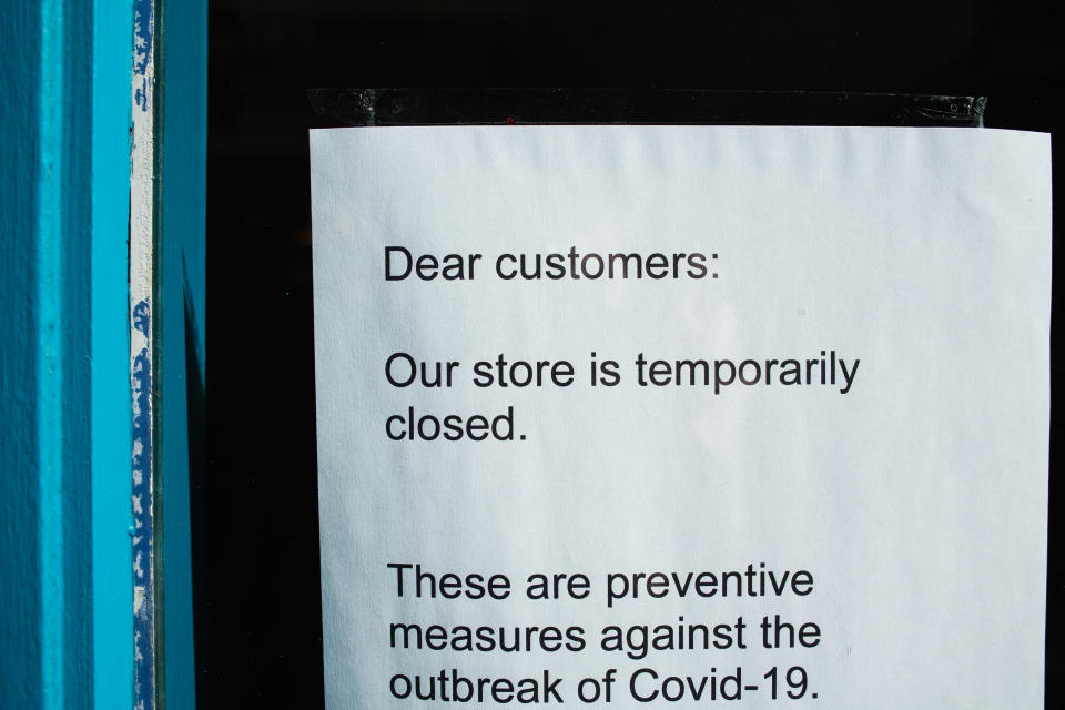 A notice informs customers of the temporary closure of a clothing store, shut over coronavirus concerns, on Carnaby Street in London, England, on March 21, 2020. Much of central London was virtually empty today, a day after British Prime Minister Boris Johnson ordered the closure of all pubs, bars, cafes and restaurants around the country. The move represents a toughening of measures to enforce the 'social distancing' that is being urged on citizens to reduce the growth of covid-19 coronavirus infections. Nightclubs, theatres, cinemas, gyms and leisure centres were also ordered closed. Some shops in the centre of capital remained open today, albeit mostly deserted of customers; many retailers however have temporarily closed their doors until the crisis abates. (Photo by David Cliff/NurPhoto via Getty Images)