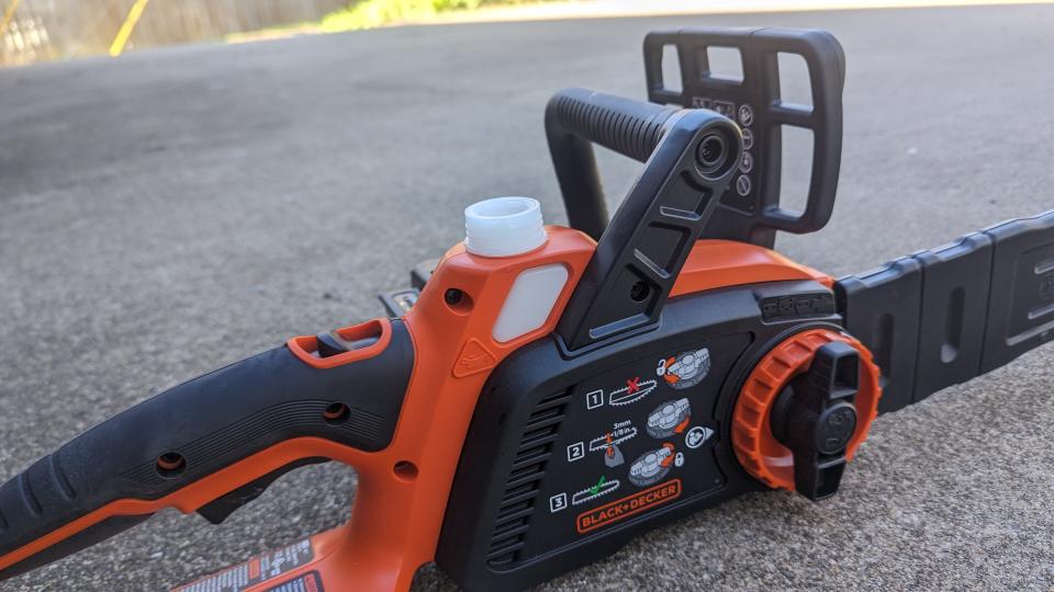 Image showing a close-up of the oil container on top of the BLACK + DECKER 40V MAX 12-inch Cordless Chainsaw