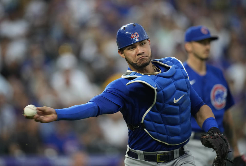 Chicago Cubs catcher Willson Contreras throws to first base to put out Colorado Rockies' Kyle Freeland after Freeland put down a sacrifice bunt in the second inning of a baseball game Tuesday, Aug. 3, 2021, in Denver. (AP Photo/David Zalubowski)