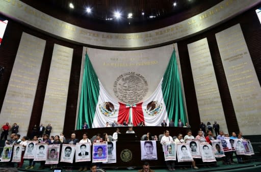 Relatives of the 43 missing students protest at the Mexican Congress to mark five years since their disappearance, in this photo released by the Mexican Congress