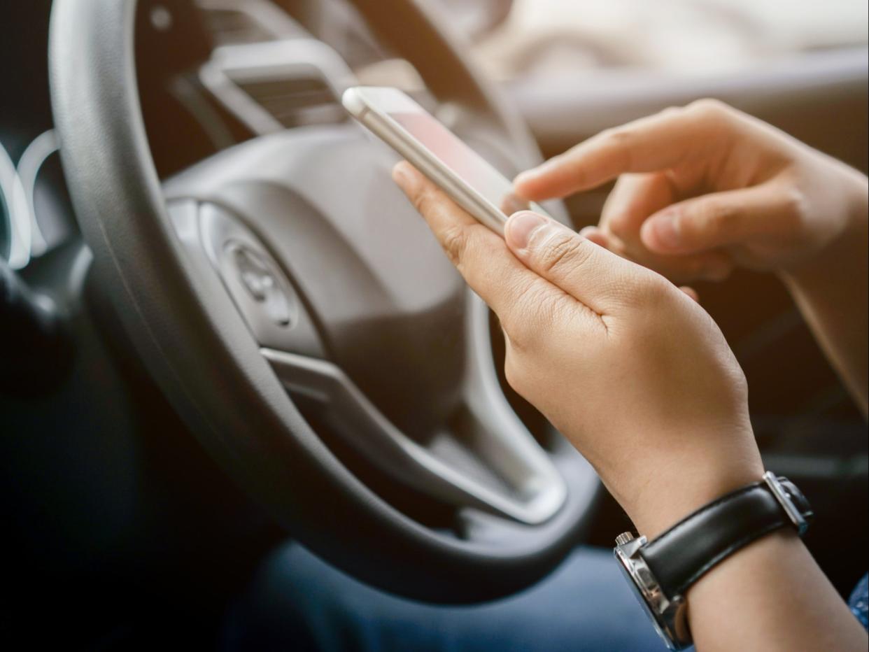 A loophole currently allows motorists to take photos while driving (Getty Images/iStockphoto)