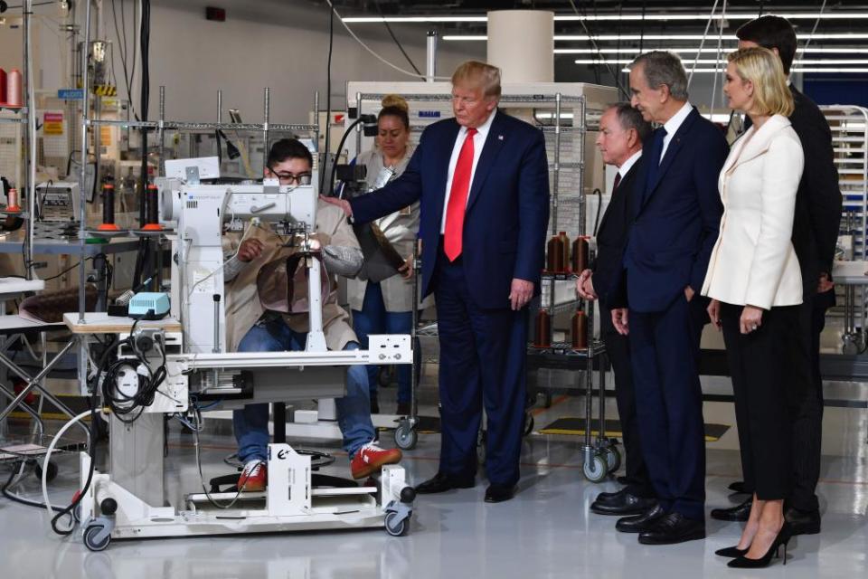 US-LUXURY-GOVERNMENT-VUITTON-TRUMP(FromR) Ivanka Trump, advisor to the US president, Alexandre Arnault, Chief Executive of LVMH (Louis Vuitton Moet Hennessy) Bernard Arnault, CEO of Louis Vuitton Michael Burke and US President Donald Trump visit the new Louis Vuitton factory in Alvarado (40 miles south of Fort Worth), Johnson County, Texas on October 17, 2019. - A workshop of the French brand Louis Vuitton will be inaugurated in Texas by Donald Trump, in the presence of Bernard Arnault, CEO of LVMH, who had indicated to the American President in 2017 that he was ready to invest more in the United States. (Photo by Nicholas Kamm / AFP) (Photo by NICHOLAS KAMM/AFP via Getty Images)