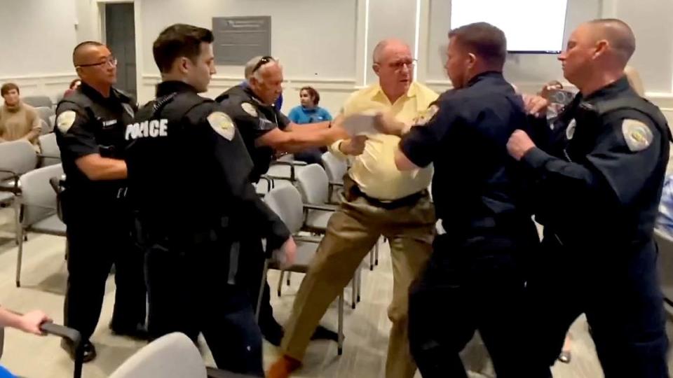 In this still taken from a submitted video, Bluffton Police forcibly remove local government critic Skip Hoagland from the March 14, 2023, Bluffton Town Council meeting held at town hall.