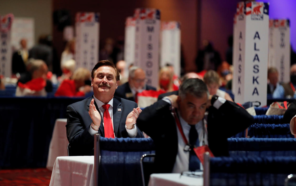 My Pillow CEO Michael Lindell applauds as he awaits the arrival of U.S. President Donald Trump on the convention floor after delegates voted to confirm the president as the Republican 2020 presidential nominee for re-election on the first day of the Republican National Convention in Charlotte, North Carolina, U.S., August 24, 2020. REUTERS/Carlos Barria